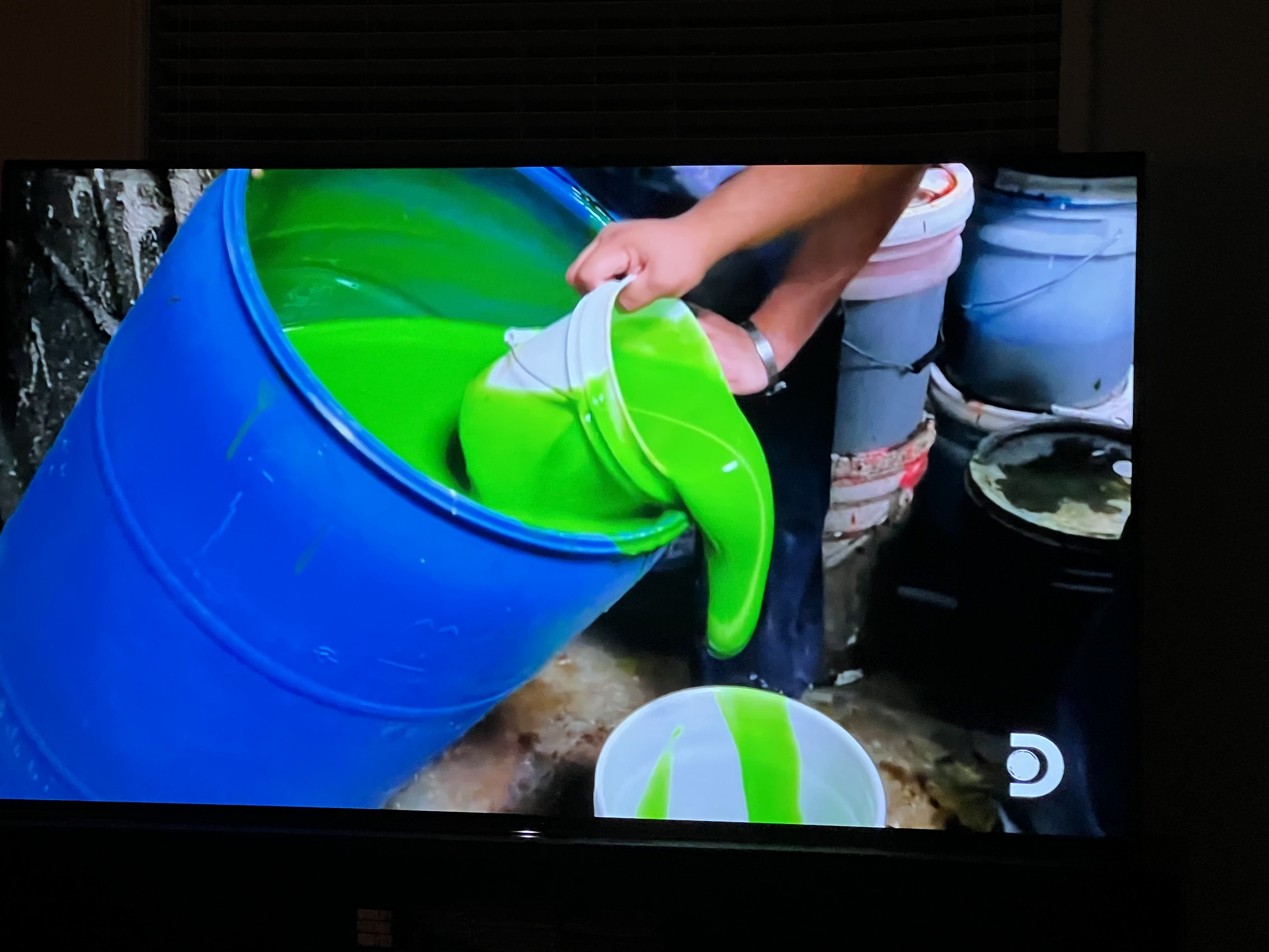 Large drum filled with vibrant green slime special effect material
